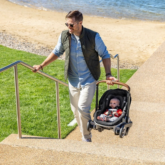 Effortlessly handle stairs and rough terrain with a car seat that has wheels for you.