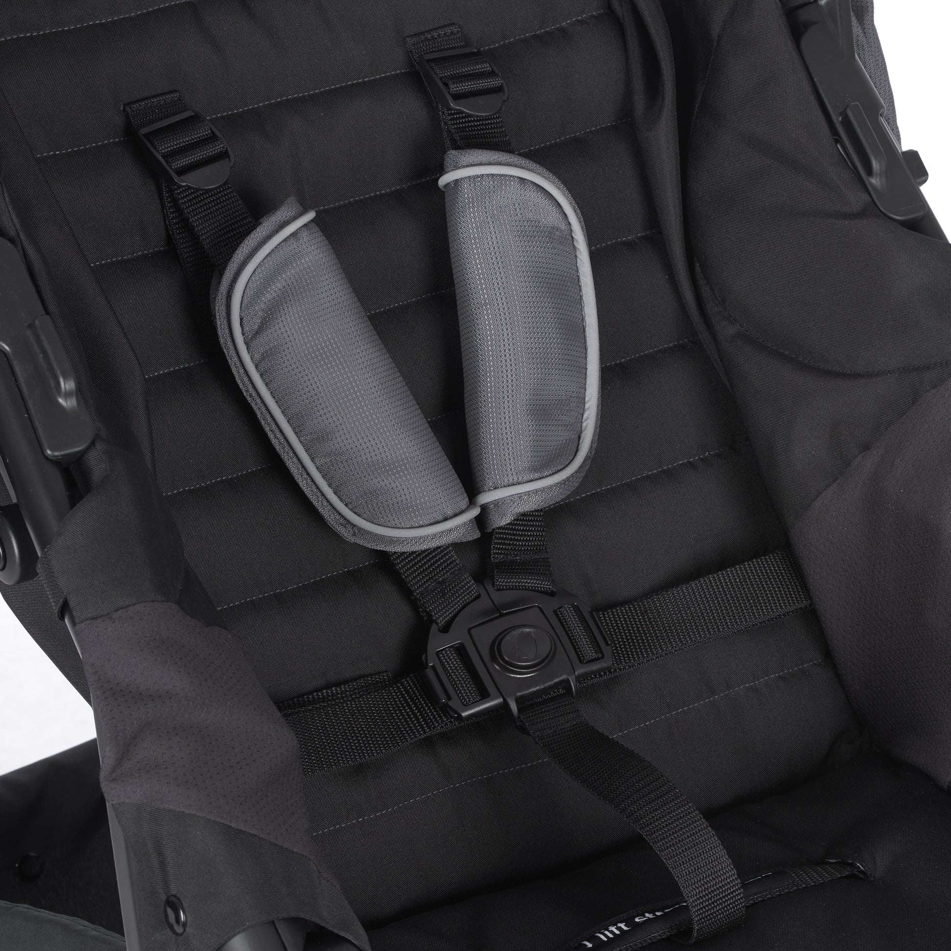 Black backpack with a shoulder strap and padding on a white background