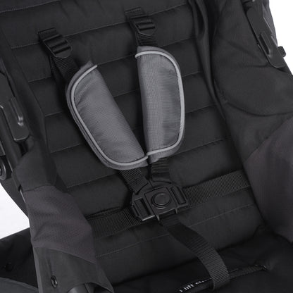 Black backpack with a shoulder strap and padding on a white background