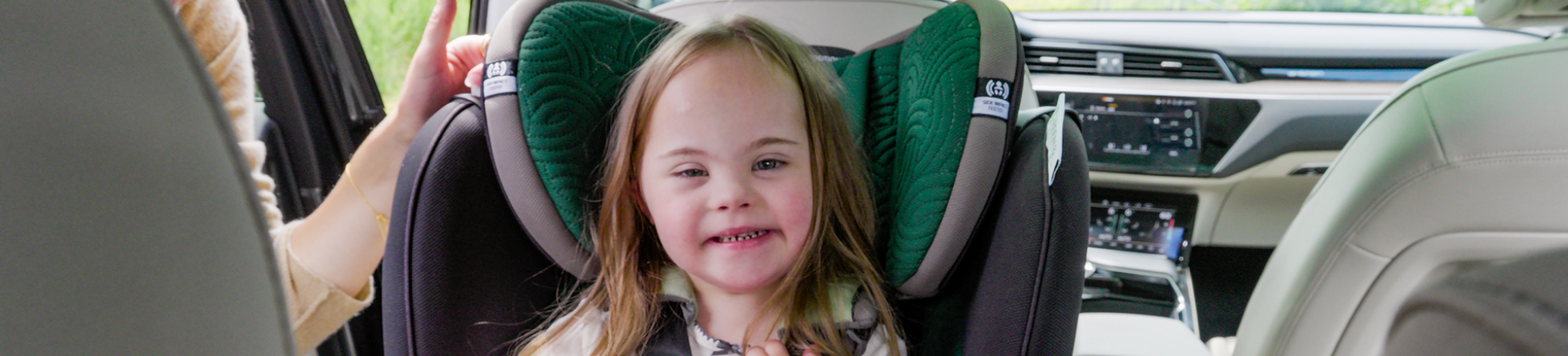 Watch your sweet, happy child smile at you, safe and secure in their car seat.