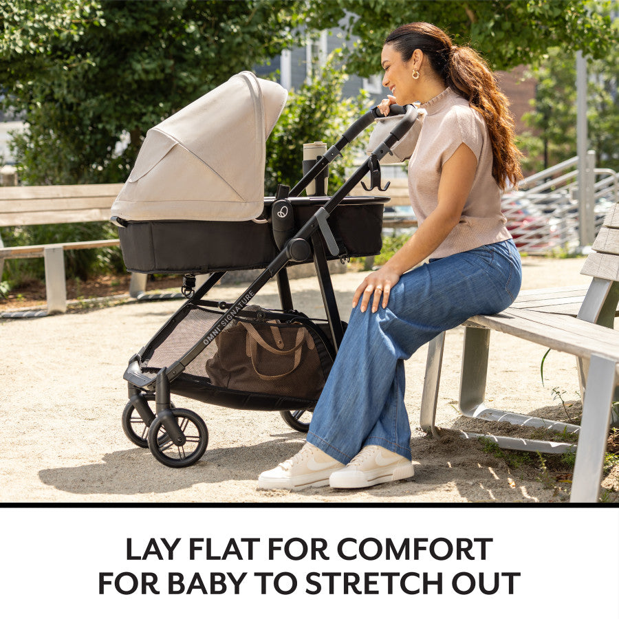 Relax on a park bench while your baby rests comfortably in their stylish bassinet stroller.