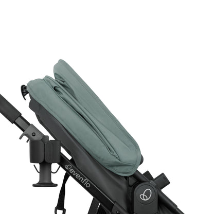 Green canopy on a black stroller