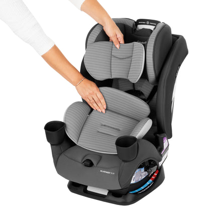 Hands adjusting the removable head and body pillow inserts on an Evenflo All-in-One car seat.