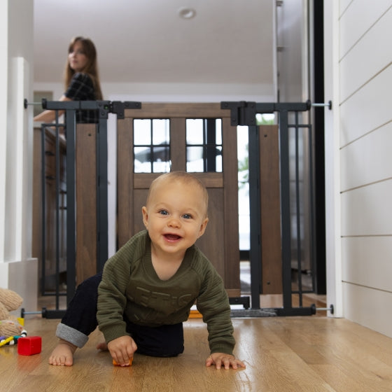 Ensure your baby's safety with a secure gate, letting them play happily while you watch.