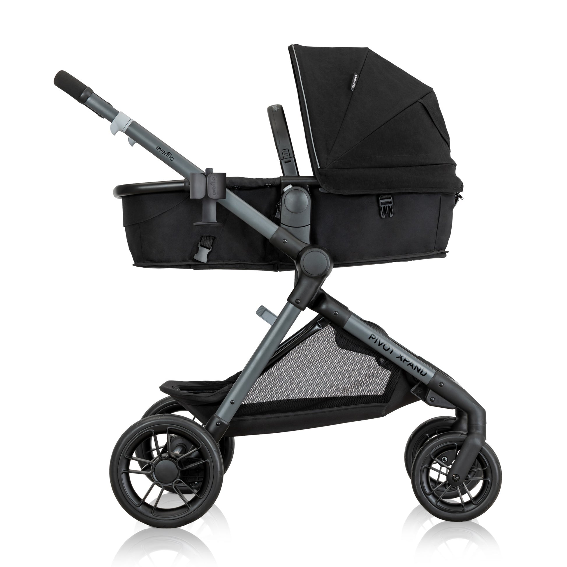 Side view of a black and gray Evenflo Pivot Expand stroller in its bassinet configuration.