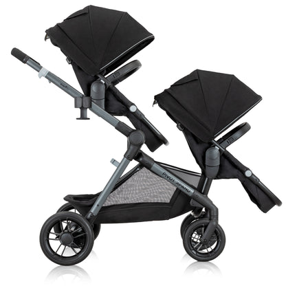 Black stroller with folded seat on a white background
