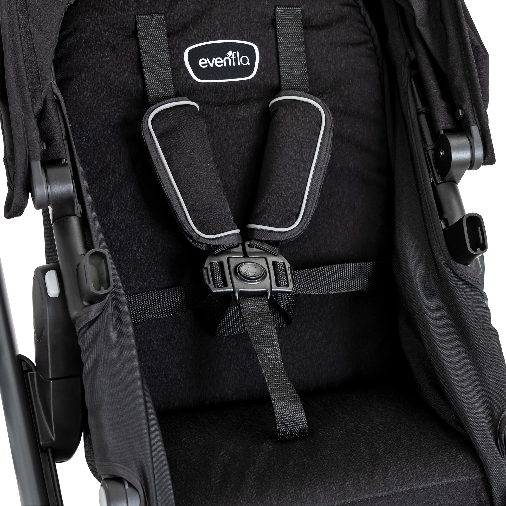 Black stroller seat with harness system and Eventa logo on a white background