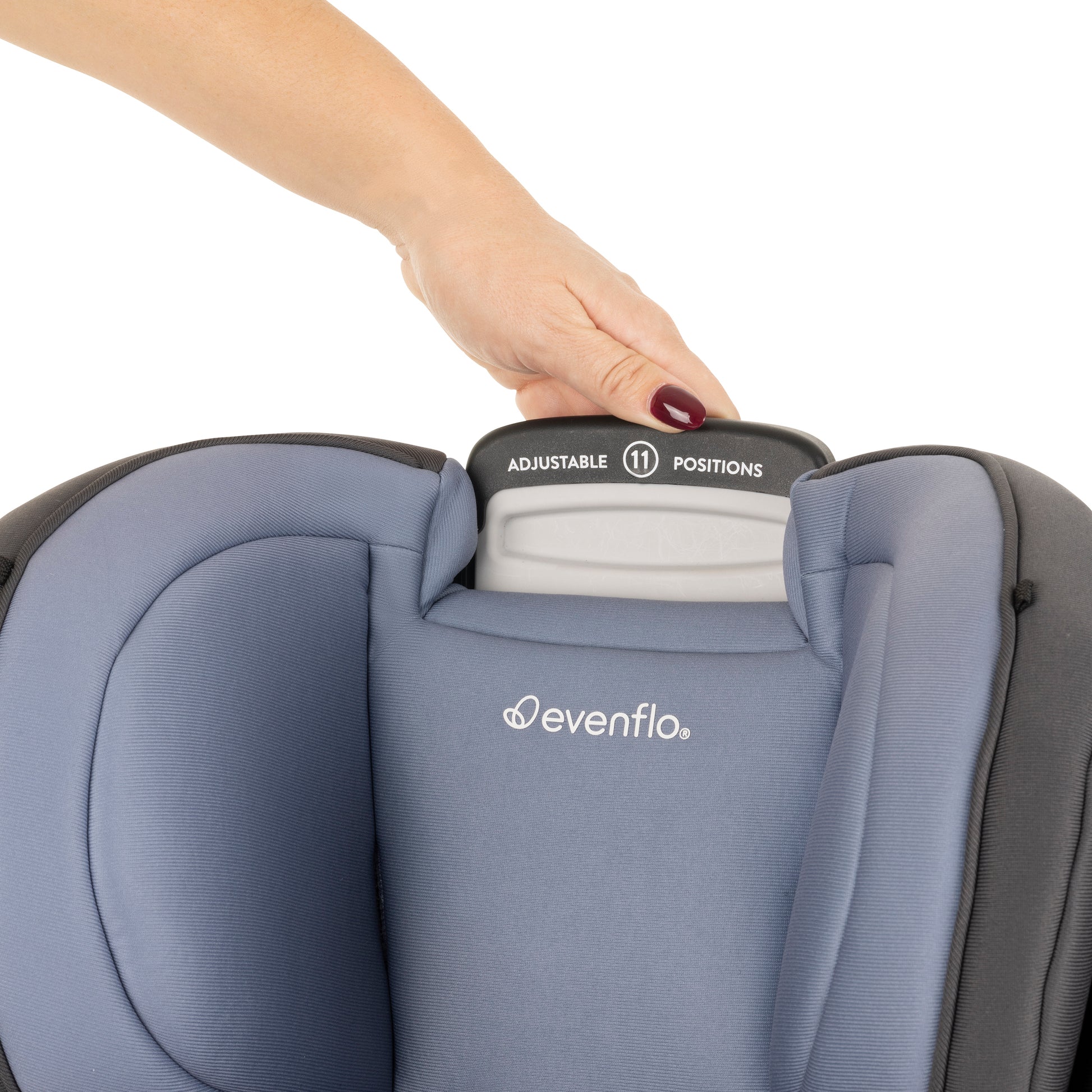 Evenflo car seat with adjustable headrest and hand interacting with it on a white background