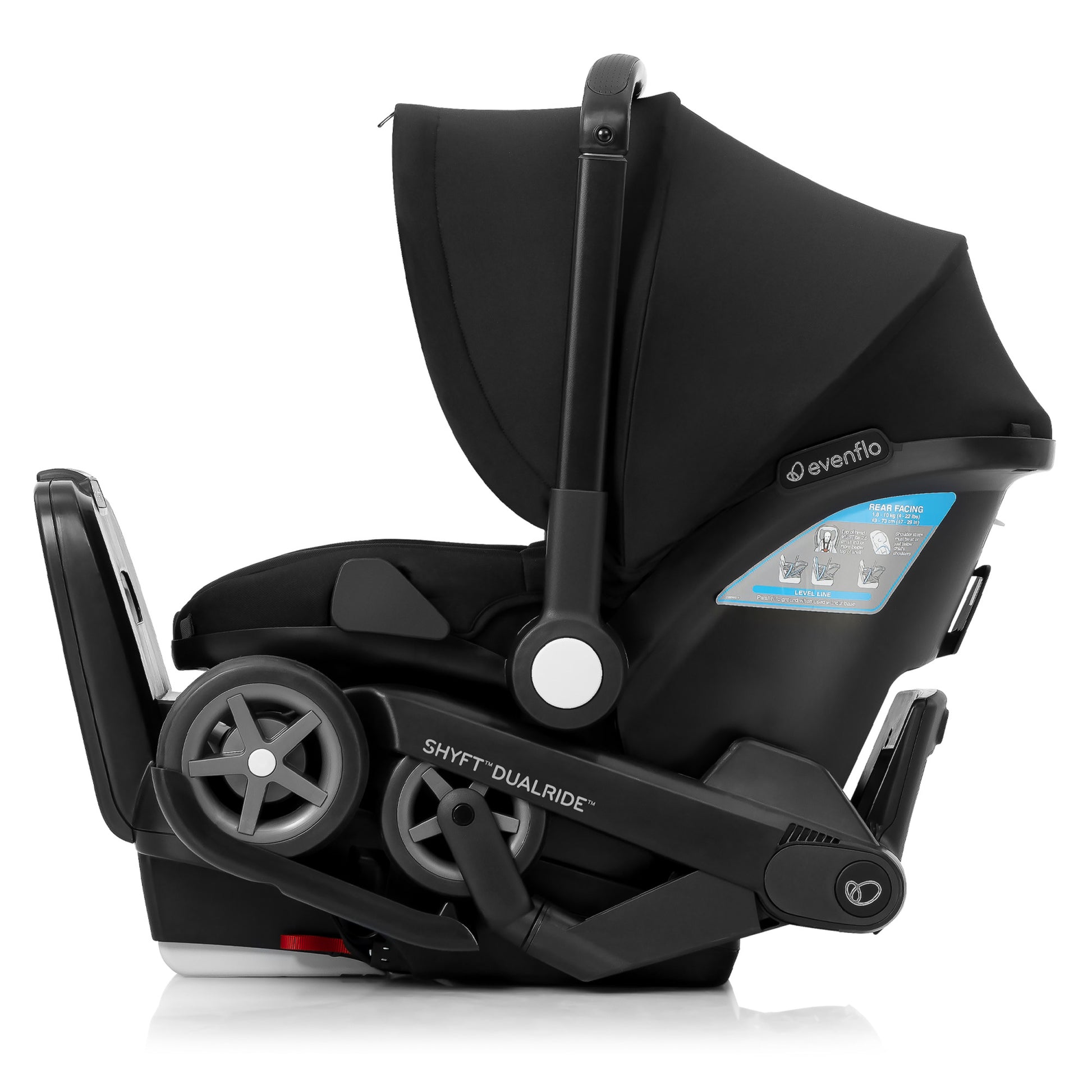 Side view of a black Evenflo Shyft DualRide infant car seat with the integrated stroller wheels folded.