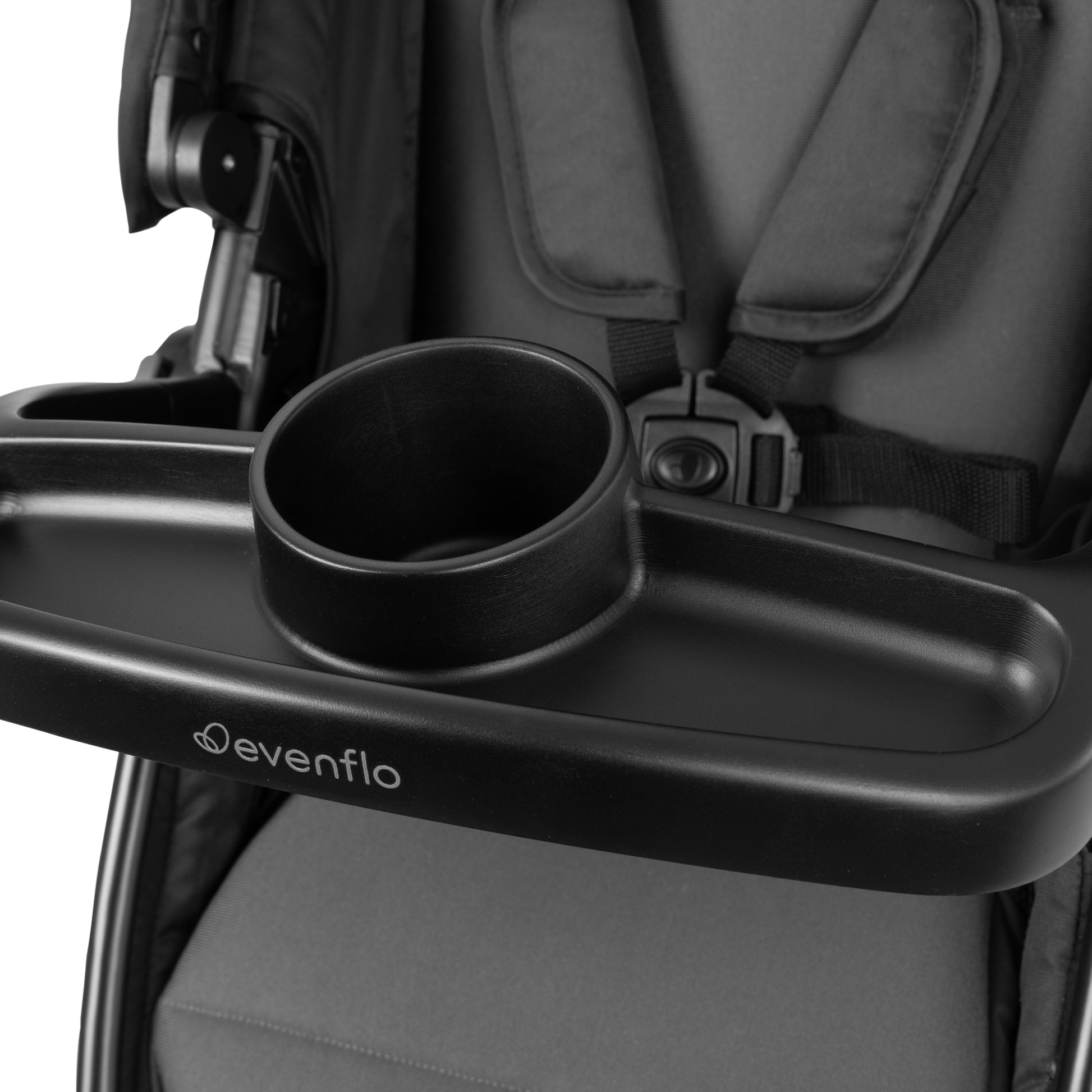 Black Evenflo stroller cup holder attached to a stroller seat.