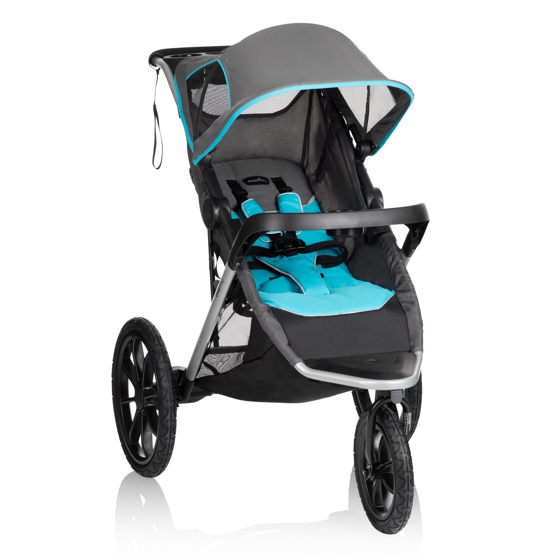 A three-wheeled gray and teal jogging stroller with a large canopy and all-terrain tires, ready for use.