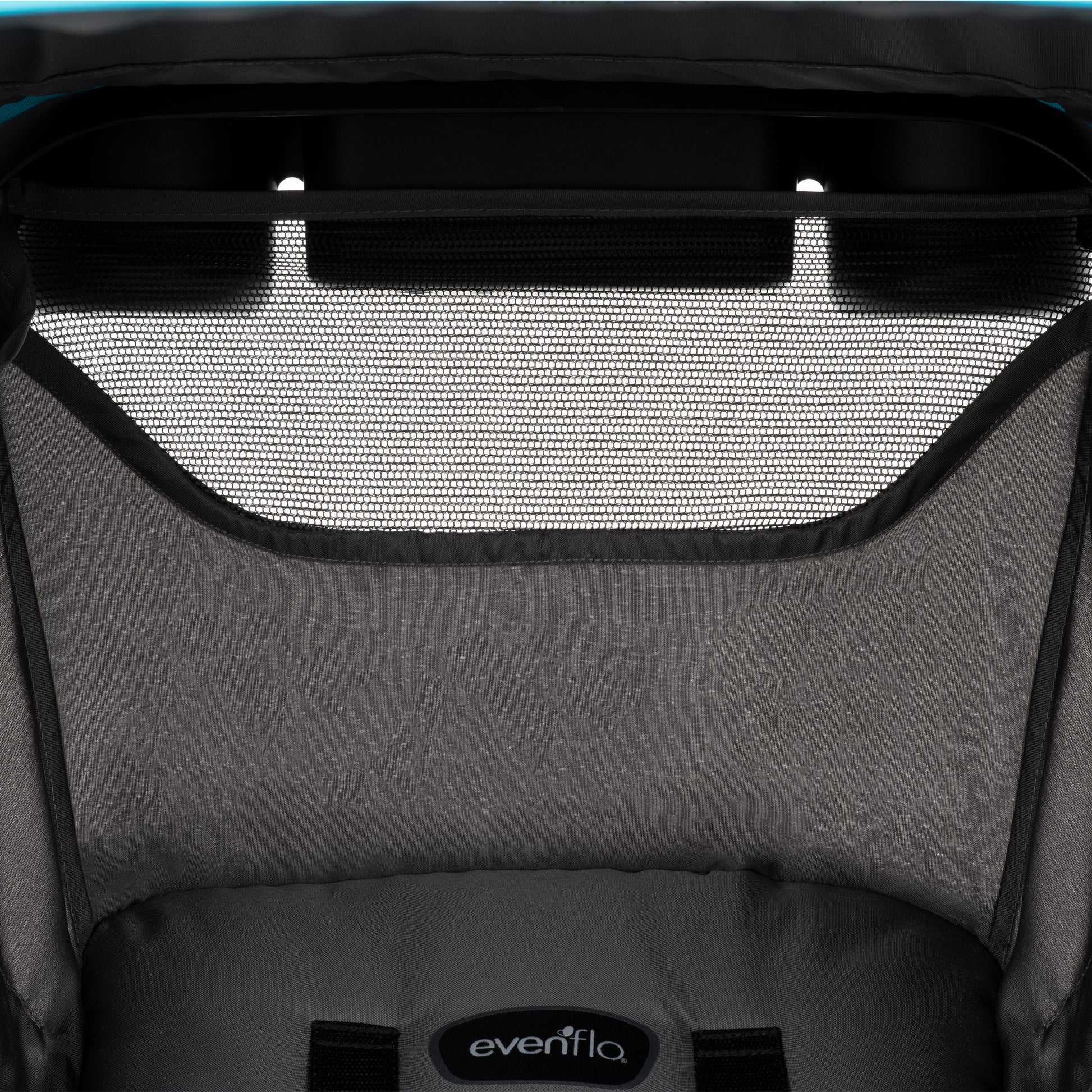 Close-up of the Evenflo baby stroller's canopy and seat, featuring a mesh peek-a-boo window.