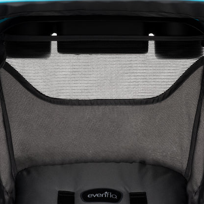 Close-up of the Evenflo baby stroller's canopy and seat, featuring a mesh peek-a-boo window.